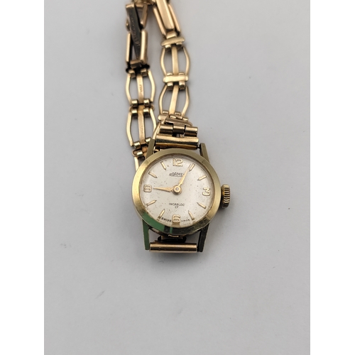 379 - A gold Roamer Incabloc 17 ladies wrist watch with original receipt watch case stamped .585/14 CT gol... 