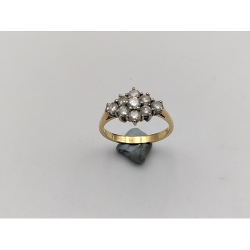 382 - A .750 stamped 18ct gold ring featuring 9 diamonds with box.(Size O) Weight 3.75 Grams.