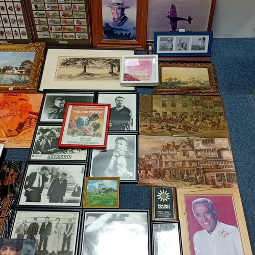 108 - A quantity of framed prints and photographs, including aviation subjects, film and popular-music ima... 