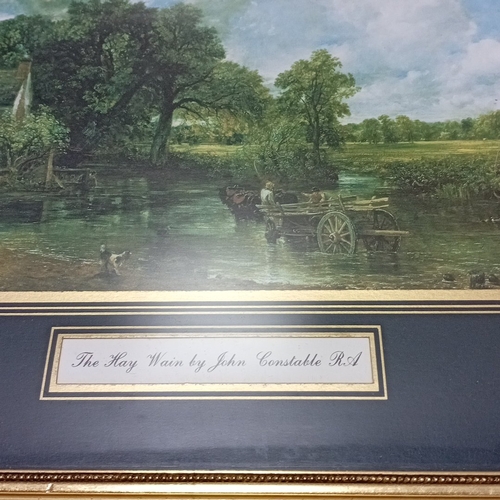 109 - A collection of framed decorative prints and needlework, including two gilt-framed landscape prints ... 