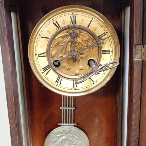 99 - Late 19th century walnut wall clock of architectural form, with barleytwist columns and glazed door ... 