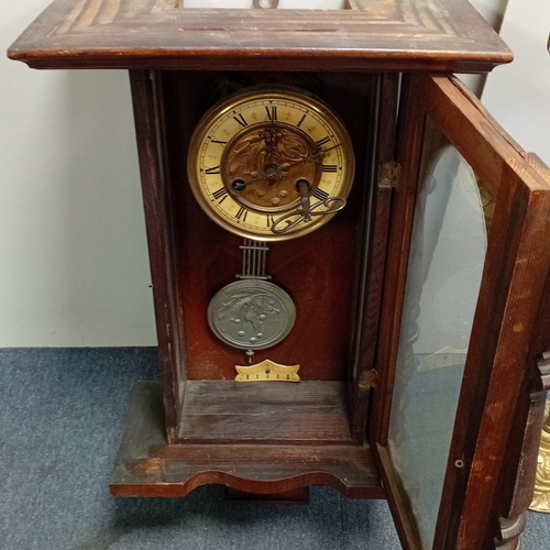 99 - Late 19th century walnut wall clock of architectural form, with barleytwist columns and glazed door ... 
