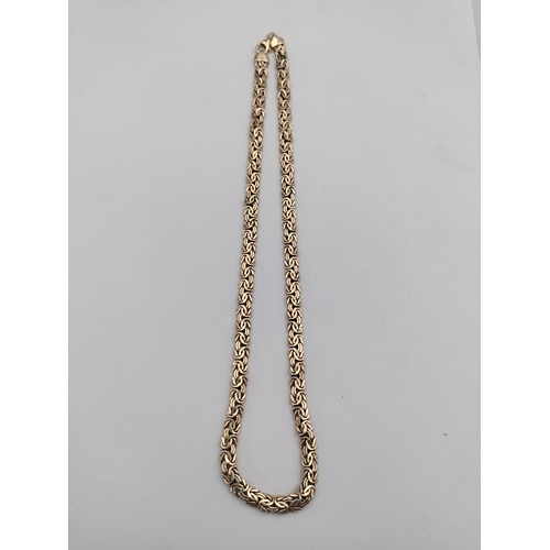 389 - A .375 stamped 9ct rose gold Byzantine link necklace. Length 17 inches. Weight 12.7 Grams.