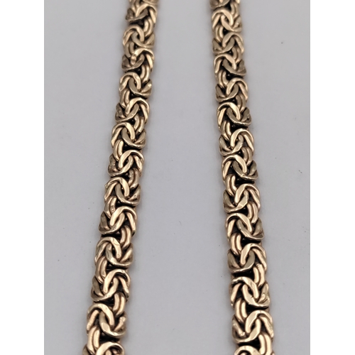 389 - A .375 stamped 9ct rose gold Byzantine link necklace. Length 17 inches. Weight 12.7 Grams.