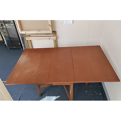 120 - Mid-20th century folding dining table in stained wood, the rectangular top with twin drop leaves, on... 