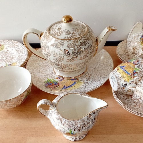26 - Empire England bone china part tea service, decorated with gilt floral scrollwork and polychrome pas... 