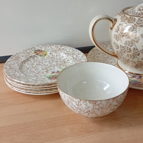 26 - Empire England bone china part tea service, decorated with gilt floral scrollwork and polychrome pas... 