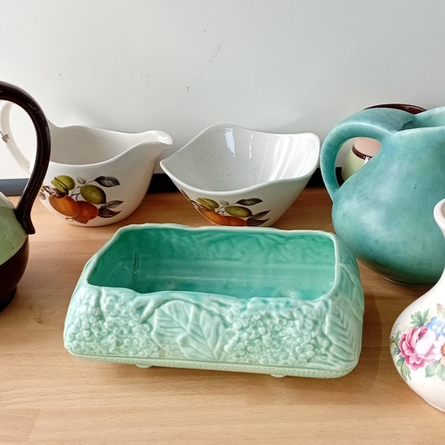 28 - A mixed lot of mid-20th century ceramic tablewares and ornaments, including an earthenware teapot, j... 