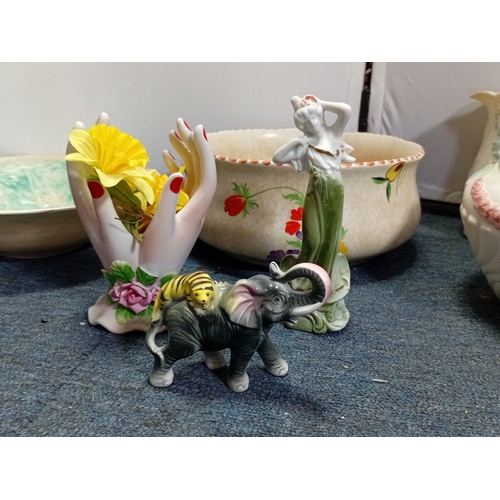 31 - A quantity of assorted decorative ceramics, including a polychrome flower-painted bowl, blue-and-whi... 