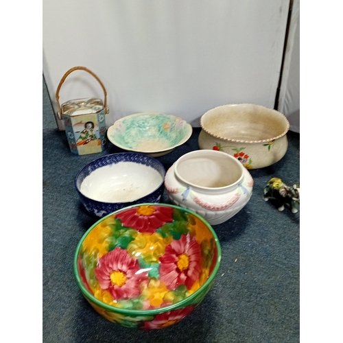 31 - A quantity of assorted decorative ceramics, including a polychrome flower-painted bowl, blue-and-whi... 