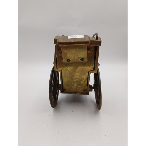 5 - A pair of brass horse-drawn carriage models, each with canopy, glazed windows, spoked wheels and har... 