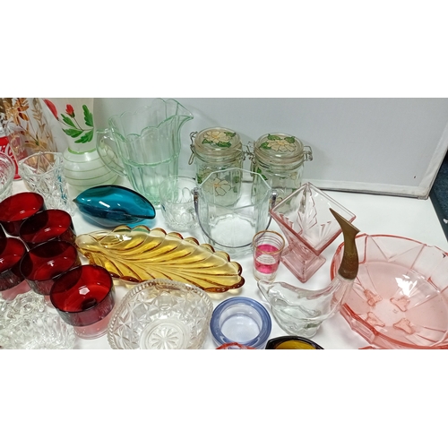 9 - A group of 20th century glass tablewares comprising moulded clear pressed bowls, ruby glass compotes... 
