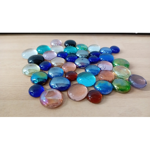 14 - A group of assorted glass marbles and glass stones, including opaque and transparent examples with c... 