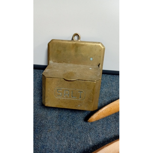 23 - An assortment of small decorative objects comprising a brass wall-mounted salt box, a pair of turned... 