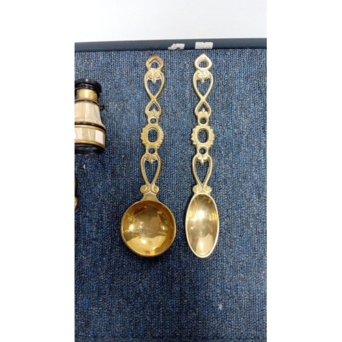 23 - An assortment of small decorative objects comprising a brass wall-mounted salt box, a pair of turned... 