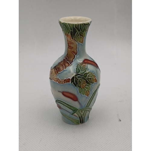 42 - Two Old Tupton Ware ceramics comprising two hand-painted vases with raised floral decoration and a R... 