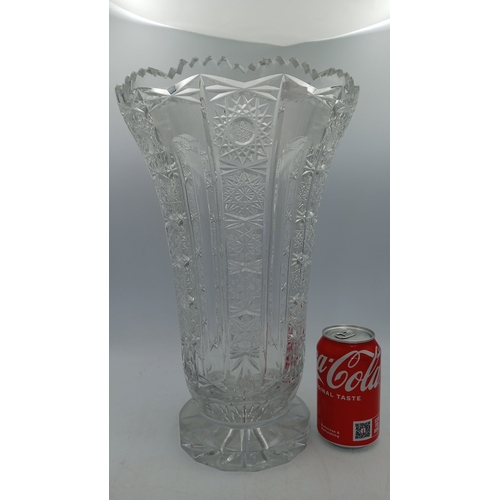 53 - Cut crystal vase of flared polygonal form, with serrated rim, alternating panels of prism-cut starbu... 