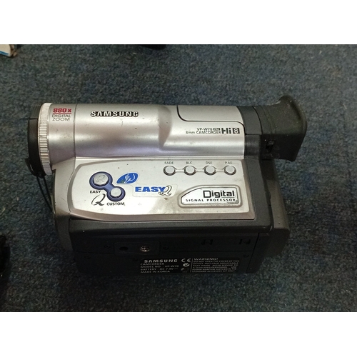 55 - A group of vintage consumer electronics including Panasonic NV-R33 VHS-C Palmcorder, Samsung VP-W70 ... 