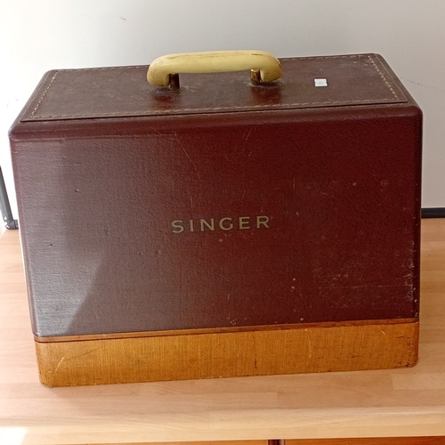 58 - Singer Manufacturing Co. electric sewing machine, Made in Great Britain, in grey enamelled metal wit... 