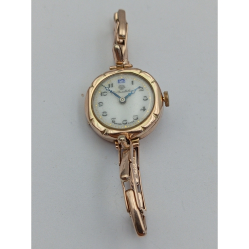131 - A 9ct hallmarked gold Thomas Russell and Son ladies wristwatch. Total weight 18.4 Grams. In working ... 
