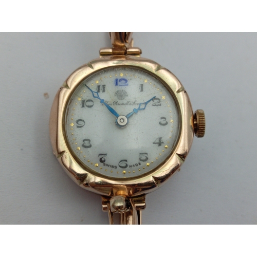 131 - A 9ct hallmarked gold Thomas Russell and Son ladies wristwatch. Total weight 18.4 Grams. In working ... 