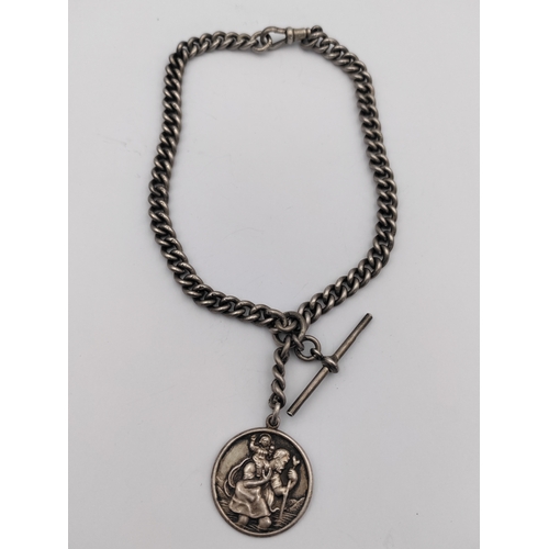 390 - A hallmarked silver Albert chain with hallmarked T bar and St Christopher pendant.