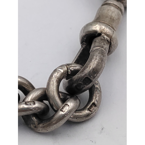 390 - A hallmarked silver Albert chain with hallmarked T bar and St Christopher pendant.