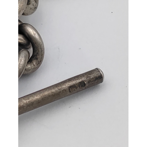 390 - A hallmarked silver Albert chain with hallmarked T bar and St Christopher pendant.