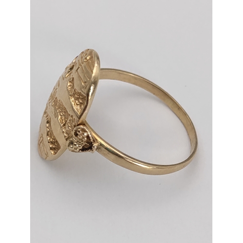 393 - A stamped 585 14ct gold signet ring. With detailed engravings and heart mounts. Size U. 3.74 grams.