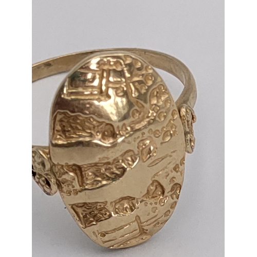 393 - A stamped 585 14ct gold signet ring. With detailed engravings and heart mounts. Size U. 3.74 grams.