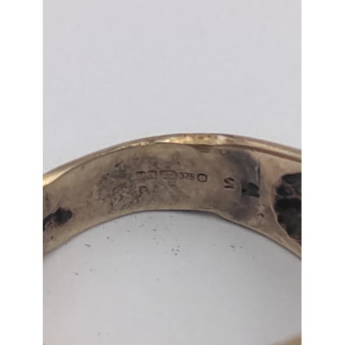 356 - A Hallmarked 375 9ct gold pave eternity ring. Set with multiple small diamonds. Size M -. Weight 4.7... 