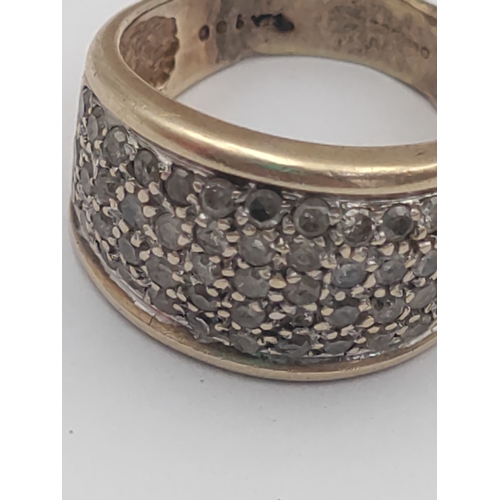 356 - A Hallmarked 375 9ct gold pave eternity ring. Set with multiple small diamonds. Size M -. Weight 4.7... 
