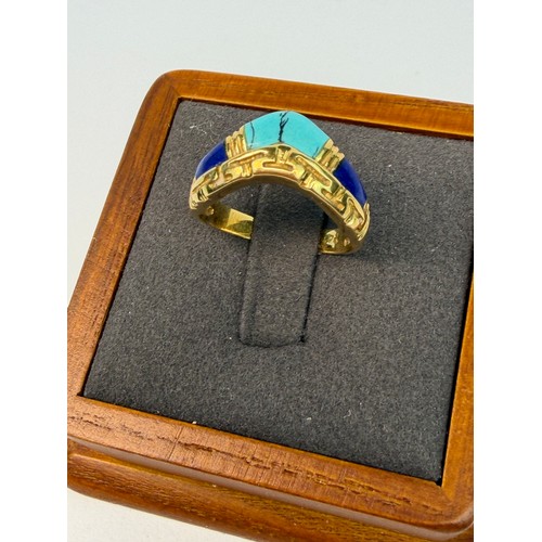 401 - An Egyptian revival 18ct gold and turquoise ring size L1/2. Weight 3.4g