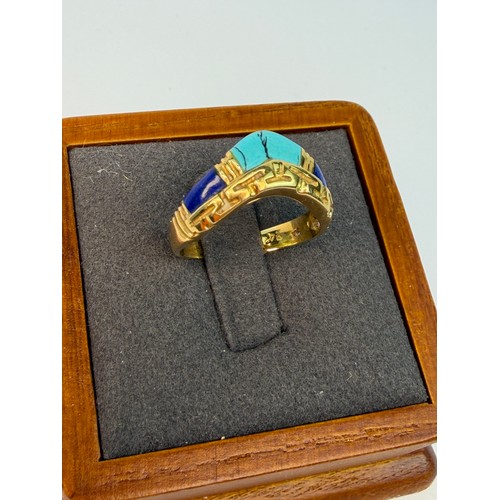 401 - An Egyptian revival 18ct gold and turquoise ring size L1/2. Weight 3.4g