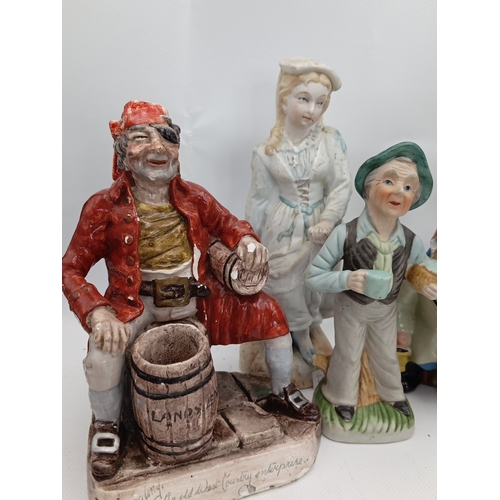 23 - A quantity of painted ceramic and resin figural ornaments, including rustic characters, child figure... 