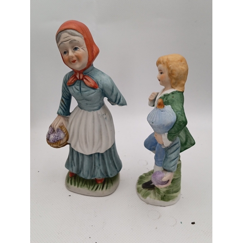 23 - A quantity of painted ceramic and resin figural ornaments, including rustic characters, child figure... 
