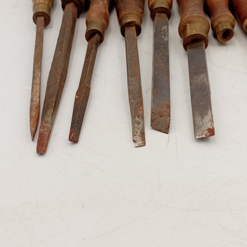 32 - A quantity of turn-of-the-century style wood-handled woodworking chisels and gouges, various profile... 