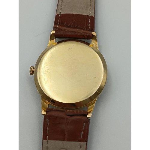 479 - A 9ct gold tudor manual wind wrist watch. Working. Dennison case. stamped rolex. Apx 10g gold.