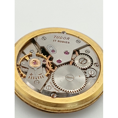 479 - A 9ct gold tudor manual wind wrist watch. Working. Dennison case. stamped rolex. Apx 10g gold.
