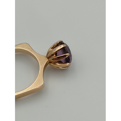 504 - A hallmarked 1977 Georg Jensen 14ct gold Scandinavian style ring set with an amethyst. Size N. 6.2 g... 
