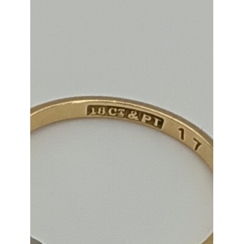506 - A stamped 18ct & platinum diamond trilogy ring. 2.2grams. .75 carat diamonds. Size M -.