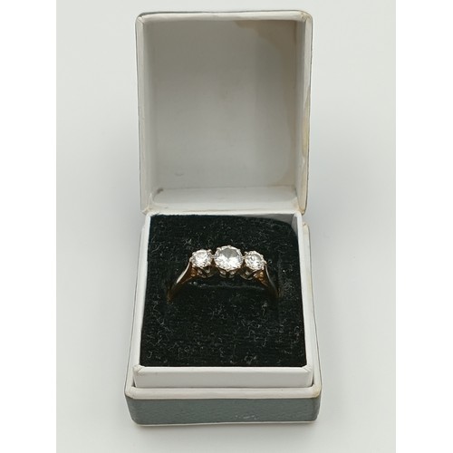 506 - A stamped 18ct & platinum diamond trilogy ring. 2.2grams. .75 carat diamonds. Size M -.