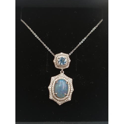 499 - A stamped 950 platinum necklace set with a 1.9ct opal, topaz and diamonds. Length 17 inches