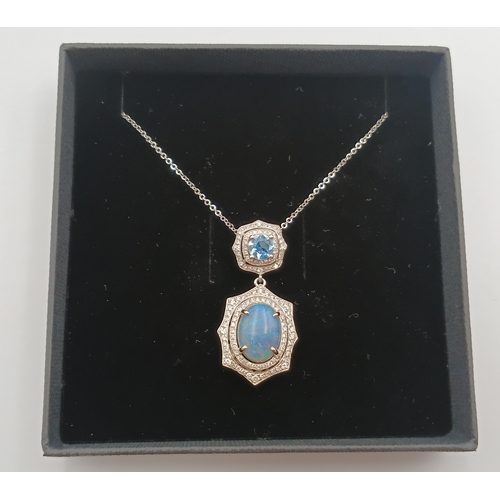 499 - A stamped 950 platinum necklace set with a 1.9ct opal, topaz and diamonds. Length 17 inches