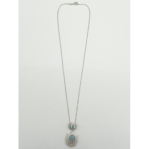 499 - A stamped 950 platinum necklace set with a 1.9ct opal, topaz and diamonds. Length 17 inches