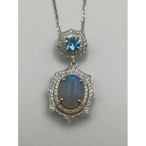 499 - A stamped 950 platinum necklace set with a 1.9ct opal, topaz and diamonds. Length 17 inches