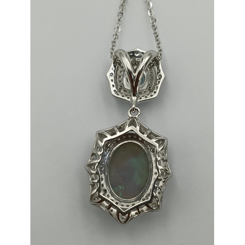 499 - A stamped 950 platinum necklace set with a 1.9ct opal, topaz and diamonds. Length 17 inches