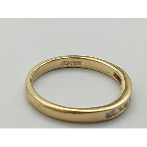 503 - A stamped 18ct gold half eternity ring set with 9 diamonds. Total weight 3g