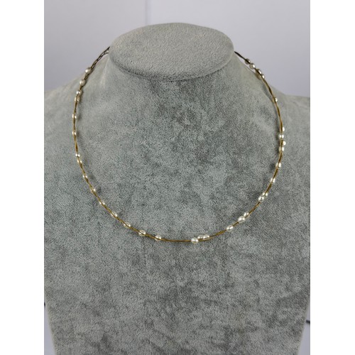 A 9ct gold and fresh water pearl necklace from beaver brooks with original box 16 inch.