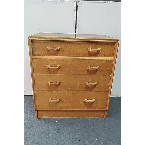 Mid-20th century G plan E Gomme teak-veneered chest of drawers, fitted with a short top drawer over three long drawers, each with paired angular pulls; plain rectangular top, on a plinth base; bearing a printed maker’s stamp. Height 33 inches x Width 30 inches x Depth 17 inches.